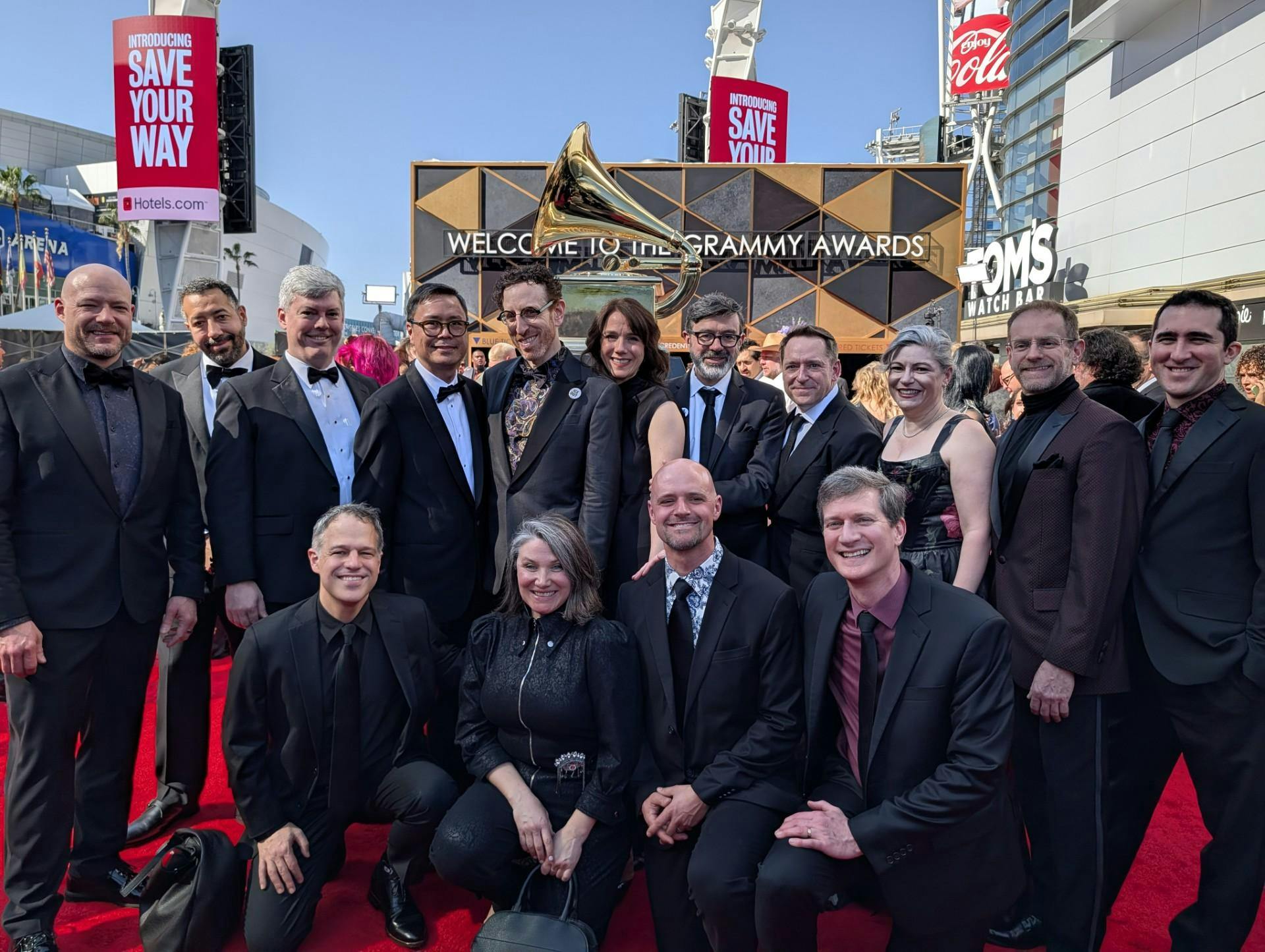 USC music professor and Alarm Will Sound member Michael Harley (far left), kneels on the red carpet at the 2026 Grammy Awards on Feb. 1. Alarm Will Sound won the award for&nbsp;Best Chamber Music / Small Ensemble Performance.