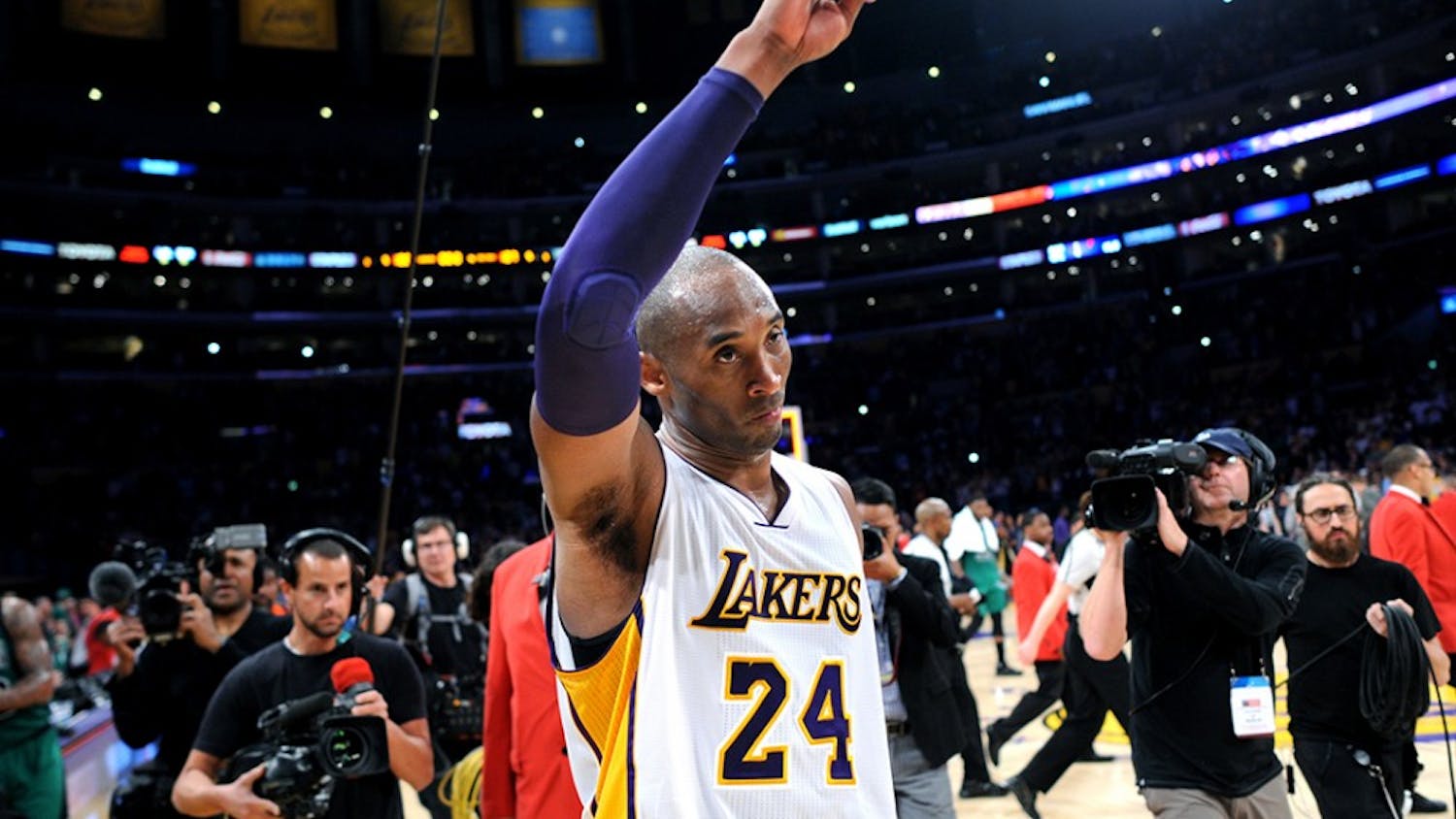 The Los Angeles Lakers&apos; Kobe Bryant waves to the crowd as he leaves the court following a 107-100 loss against the Boston Celtics at Staples Center in Los Angeles on Sunday, April 3, 2016. (Wally Skalij/Los Angeles Times/TNS)