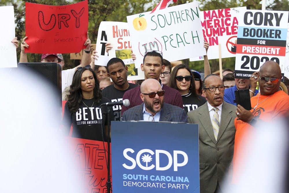 As speakers take the podium, a group of protestors gathered and chanted outside of Cory Booker's office on Oct. 25 while getting ready to march to Benedict College.&nbsp;