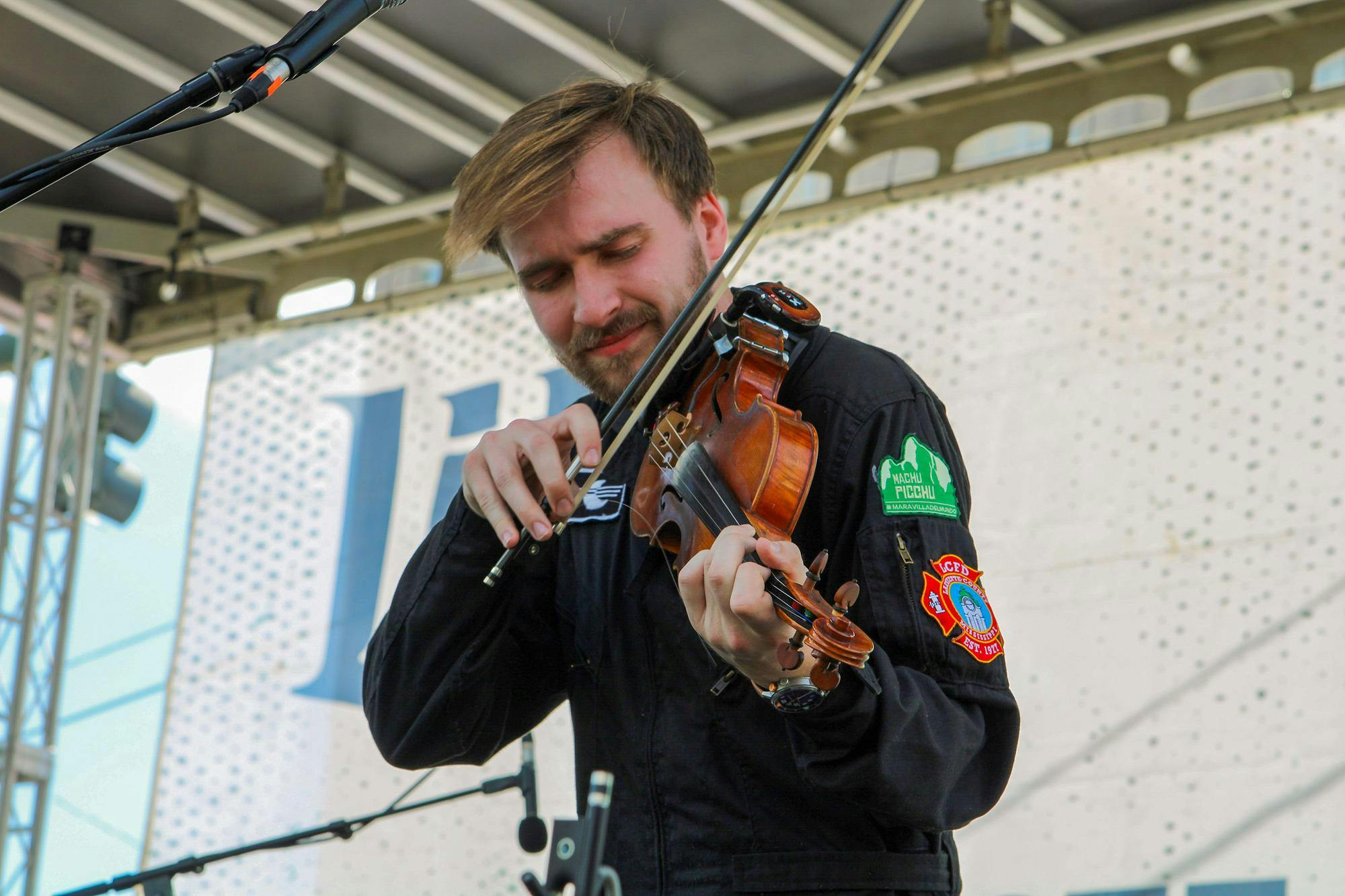 A member of the band Happy Landing performs during St. Pat's in Five Points in Columbia, South Carolina on March 16, 2024. The folk rock band from Oxford, Mississippi performed the second set of the day on the Blossom Stage.