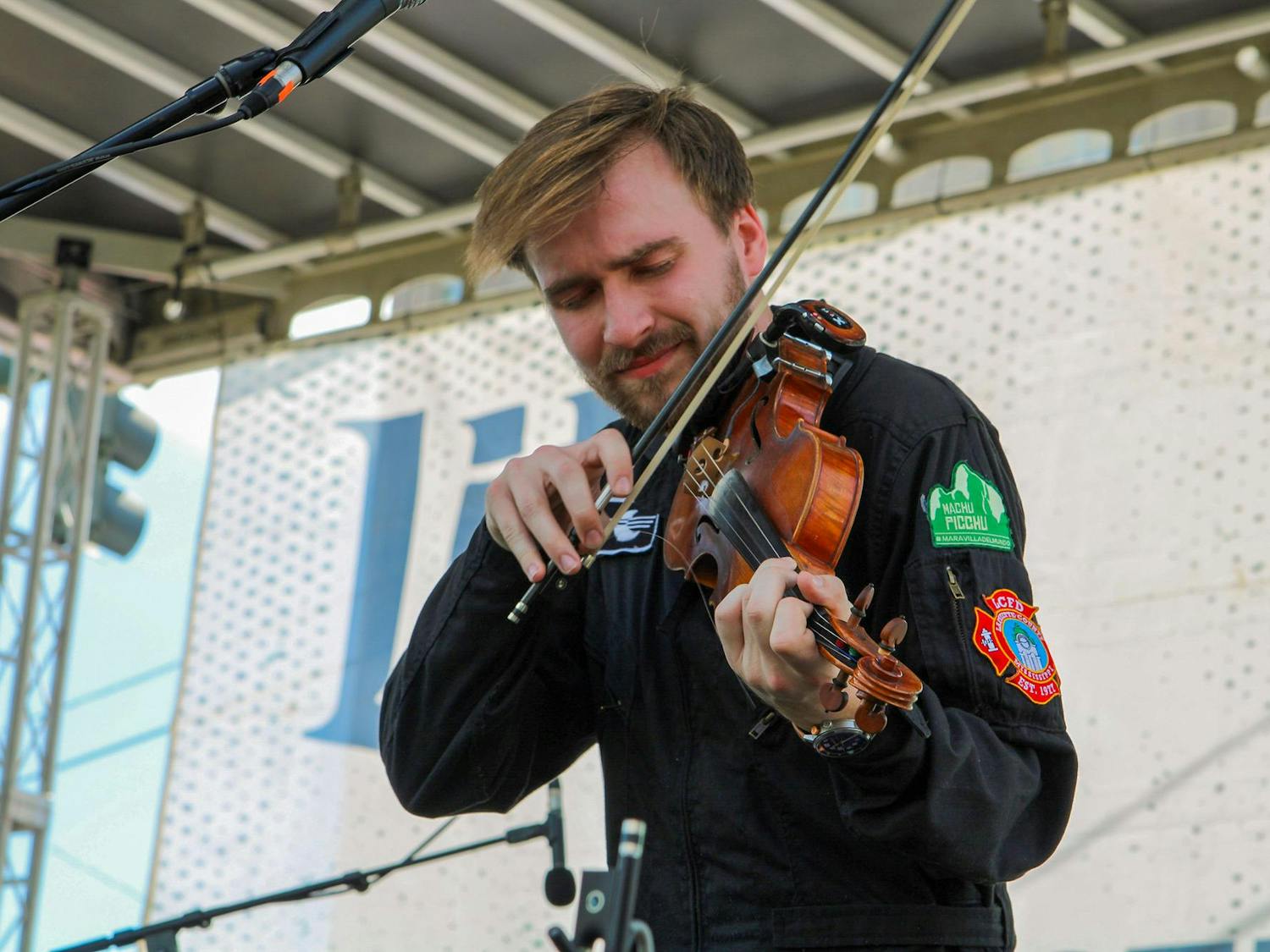 A member of the band Happy Landing performs during St. Pat's in Five Points in Columbia, South Carolina on March 16, 2024. The folk rock band from Oxford, Mississippi performed the second set of the day on the Blossom Stage.