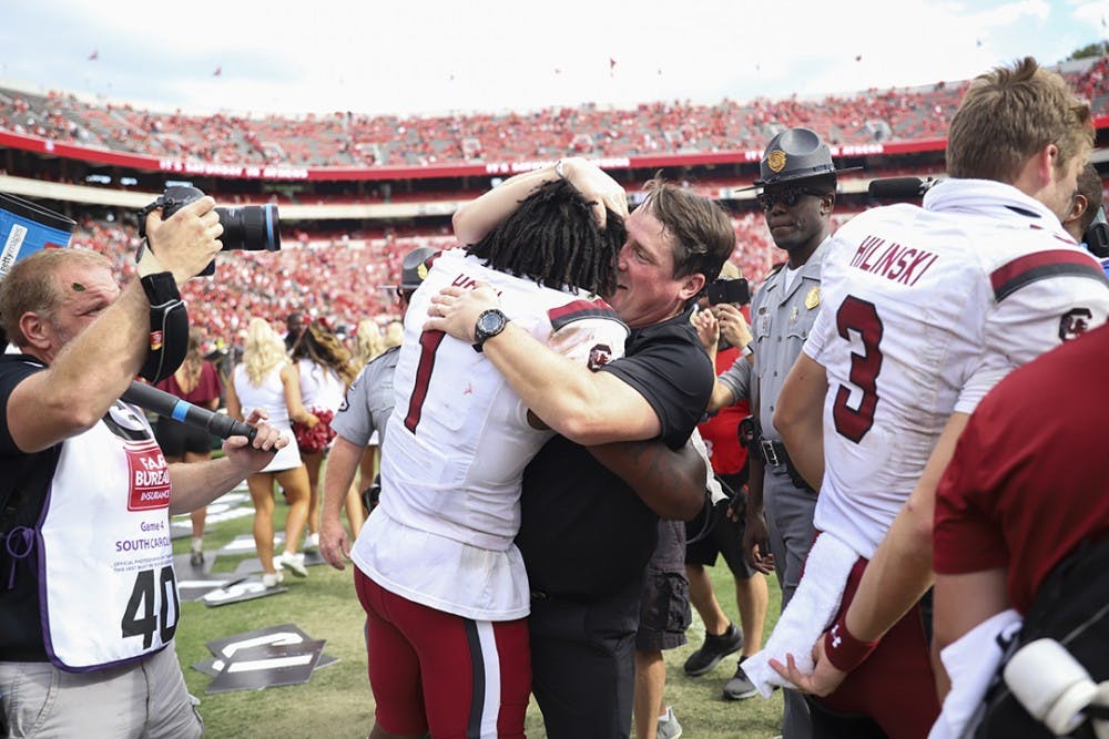 <p>Coach Will Muschamp celebrates the upset victory over No. 3 UGA with sophomore defensive back Jaycee Horn.</p>