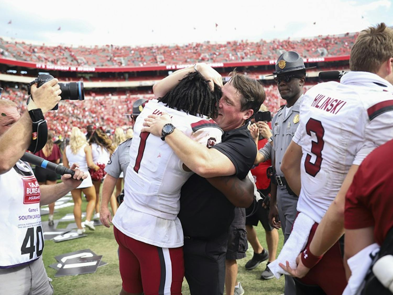 Coach Will Muschamp celebrates the upset victory over No. 3 UGA with sophomore defensive back Jaycee Horn.