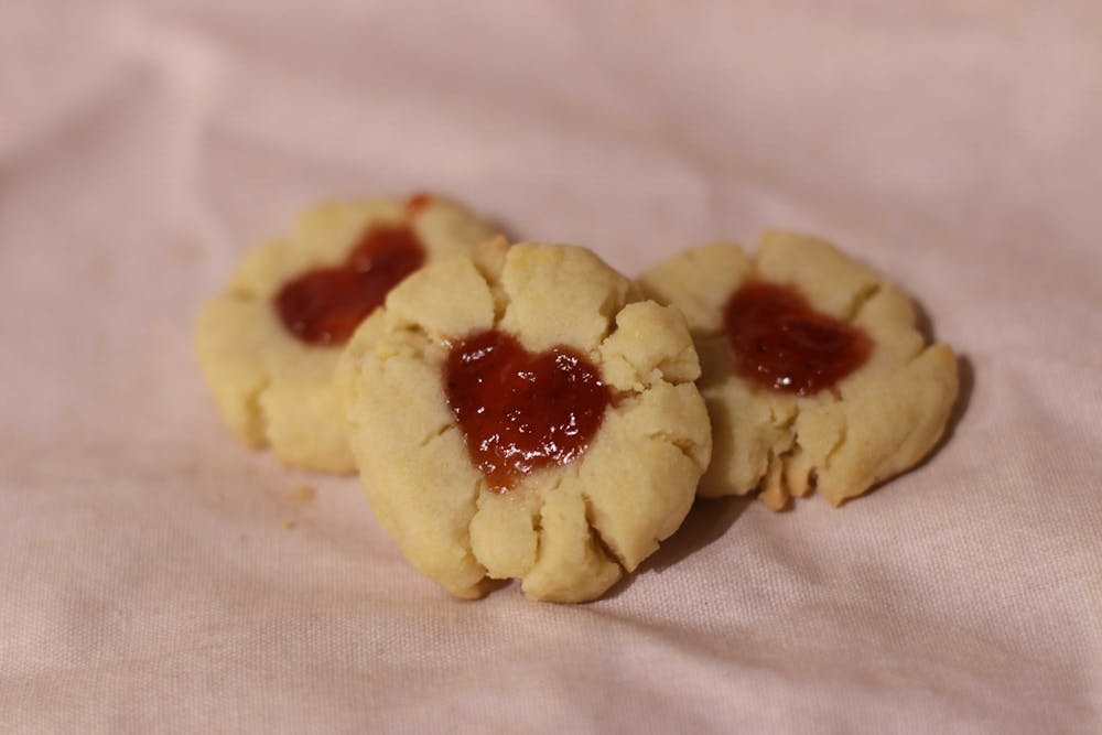 <p>Raspberry jam cookies made by Amelia Farrell on Feb. 8, 2022. The cookies bring a unique twist to the classic, buttery shortbread cookie by adding raspberry jam to form the heart center, making it a perfect snack for Valentine's Day.</p>