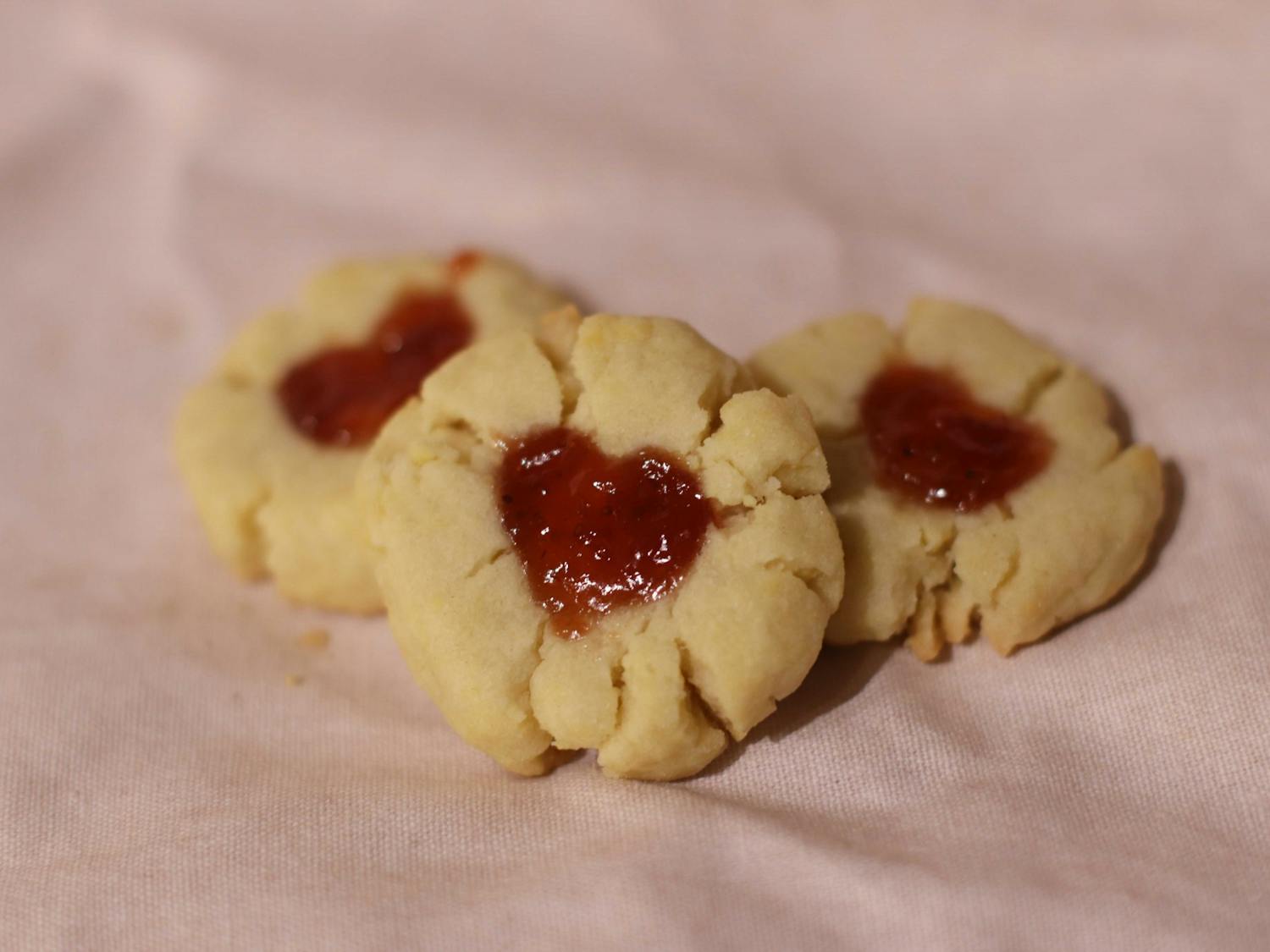 Raspberry jam cookies made by Amelia Farrell on Feb. 8, 2022. The cookies bring a unique twist to the classic, buttery shortbread cookie by adding raspberry jam to form the heart center, making it a perfect snack for Valentine's Day.