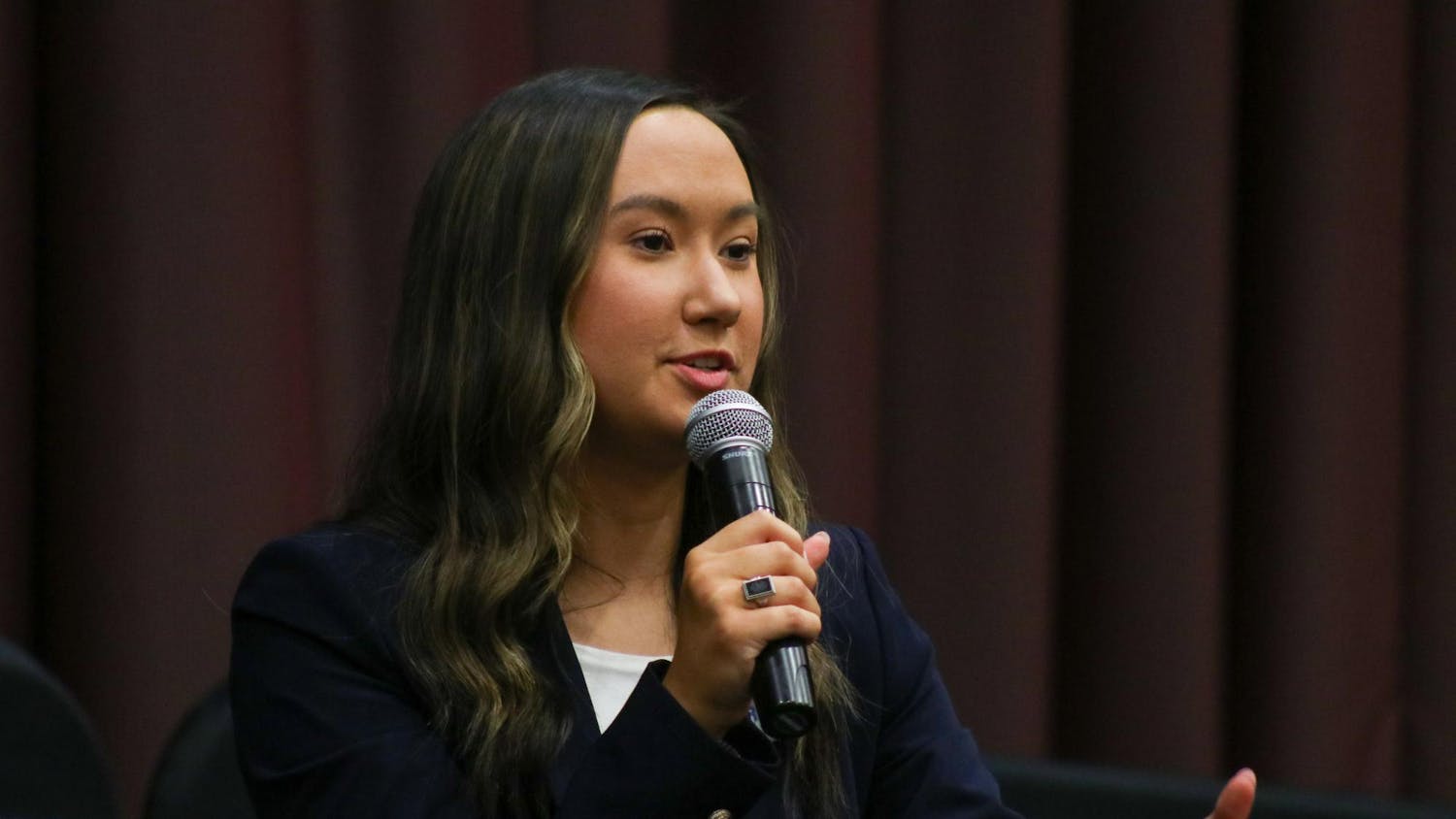 FILE - Then presidential candidate and third-year political science student Emily “Emmie” Thompson answers a question at the Student Government debate on Feb. 15, 2023. Thompson is now the student body president.