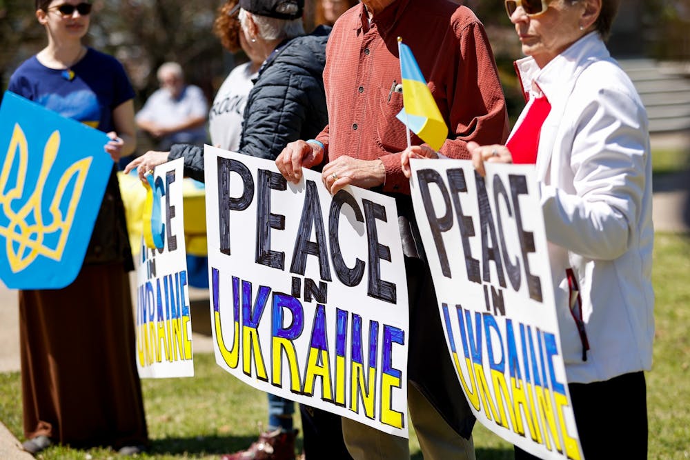 <p>Attendees hold signs in support of Ukraine during the Stand with Ukraine Rally and March at the South Carolina Statehouse on April 2, 2022. The rally was held as a response to Russia's invasion of Ukraine.</p>