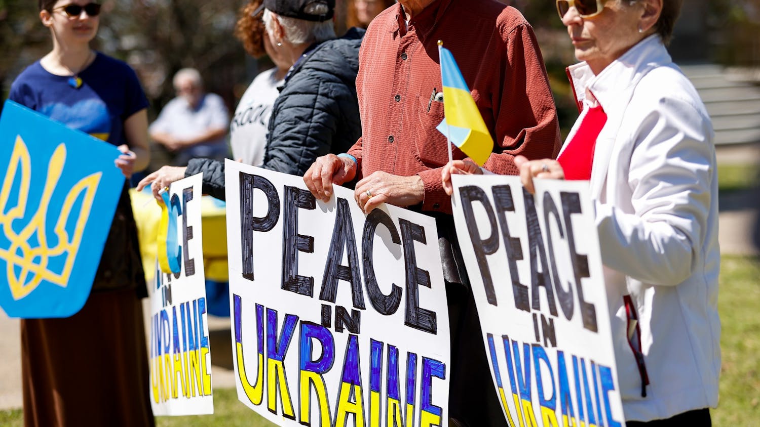 Attendees hold signs in support of Ukraine during the Stand with Ukraine Rally and March at the South Carolina Statehouse on April 2, 2022. The rally was held as a response to Russia's invasion of Ukraine.