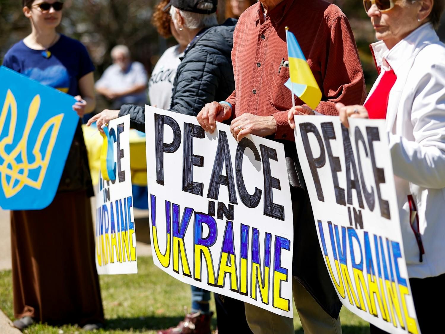 Attendees hold signs in support of Ukraine during the Stand with Ukraine Rally and March at the South Carolina Statehouse on April 2, 2022. The rally was held as a response to Russia's invasion of Ukraine.