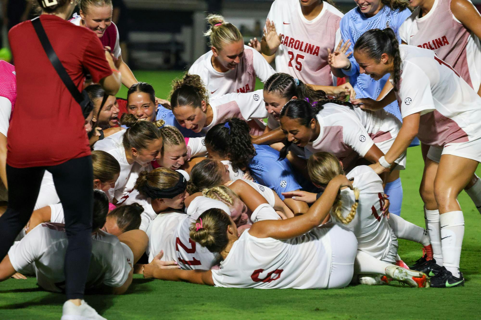 The Gamecocks hug one another and celebrate on the field over their victory against the Tigers on Aug. 20, 2026 at Eugene E. Stone III Stadium. The Gamecocks won 1-0 against the Tigers with the goal being made by senior midfielder Cuyler Zulauf.