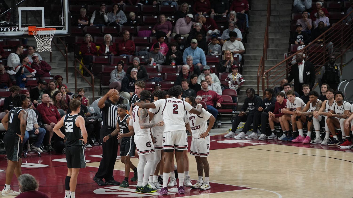 South Carolina huddles up near the free-throw line as players regroup between whistles at Colonial Life Arena. The unified moment reflected the Gamecocks’ control throughout their 82–51 win over Stetson in Columbia, South Carolina.