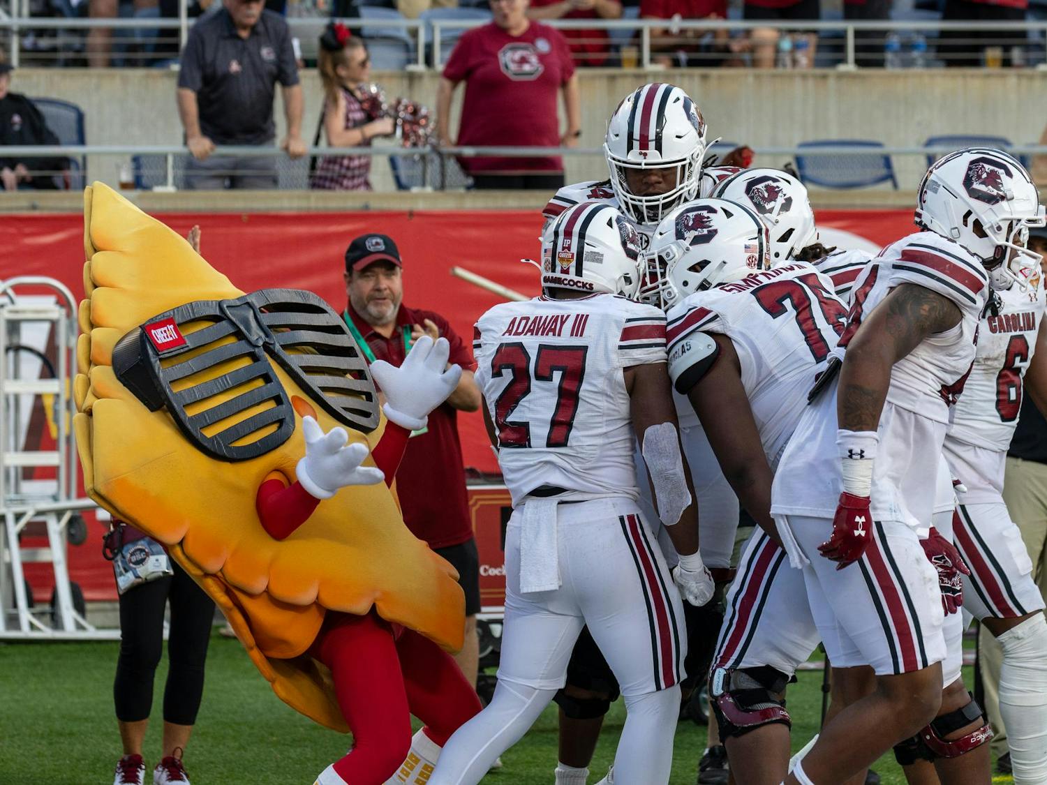 Cheez-It mascot Ched-Z celebrates with South Carolina players after the team scored a touchdown at the Cheez-It Citrus Bowl on Dec. 31, 2024. The Gamecocks lost to the Illinois Fighting Illini 21-17.