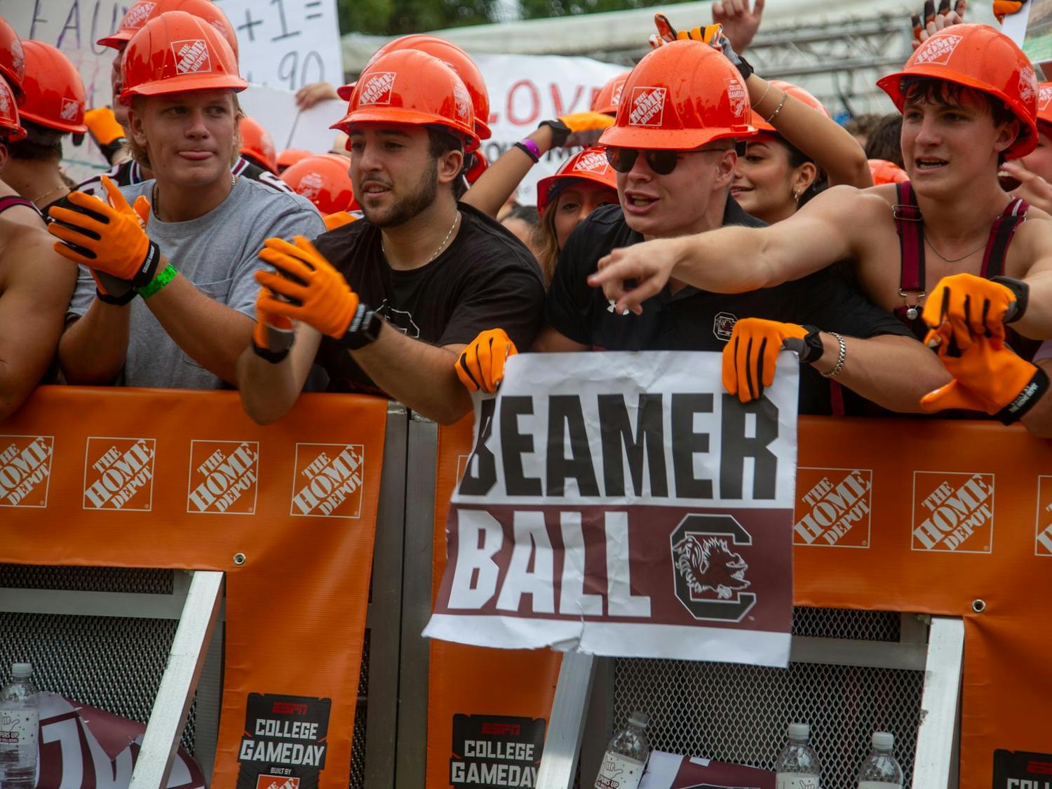 Students from the University of South Carolina hold up signs to the cameras of ESPN College GameDay on Sept. 15, 2024. Fans were lining up to be in the front row of the pit starting early the night before.
