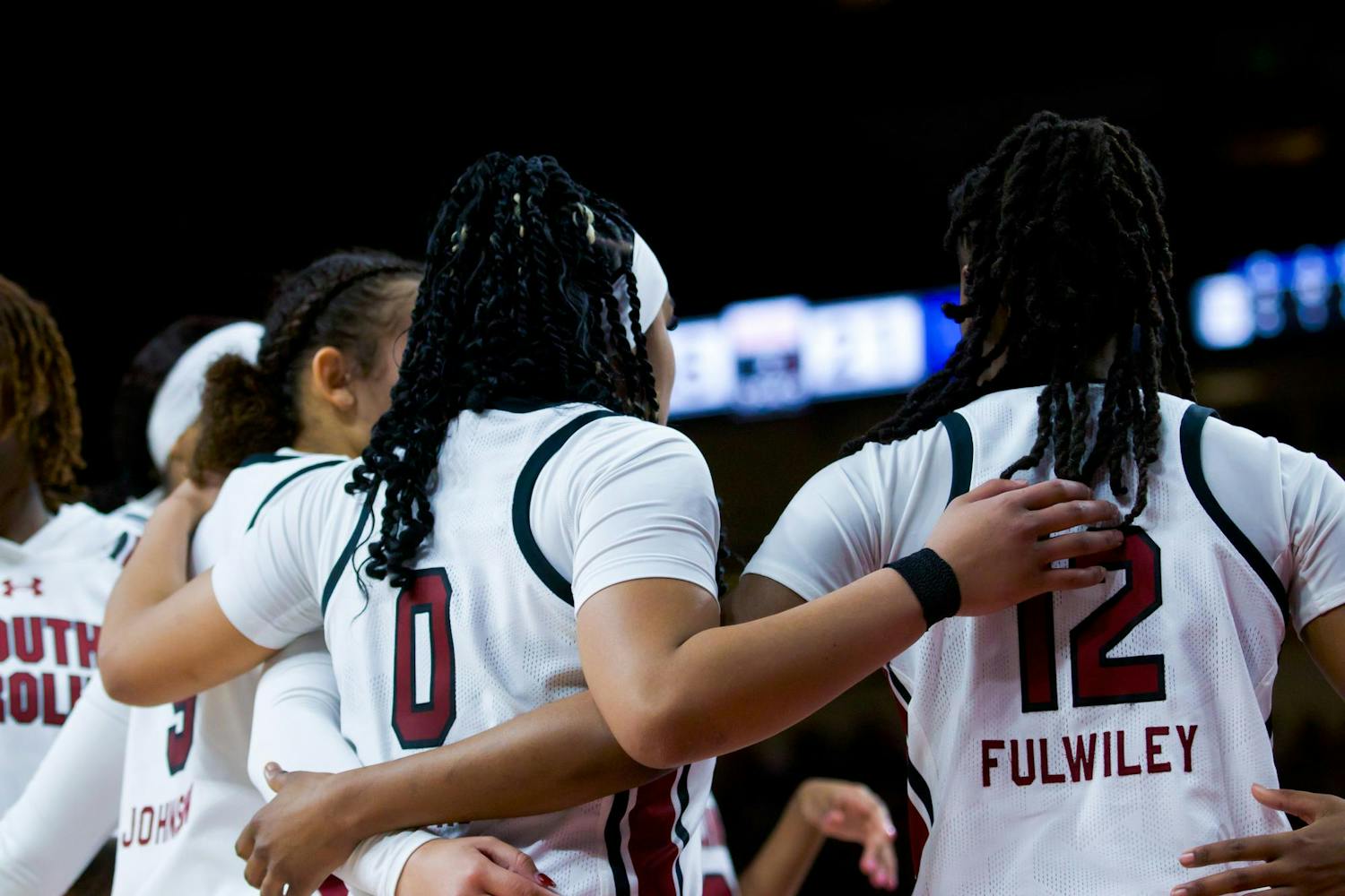 Freshman guard Tessa Johnson, senior guard Te-Hina Paopao and freshman guard MiLaysia Fulwiley huddle together during a timeout against the Wildcats. Combined, the three players attributed 39 points to South Carolina’s score of 98-36 against Kentucky on Jan. 15, 2023.&nbsp;