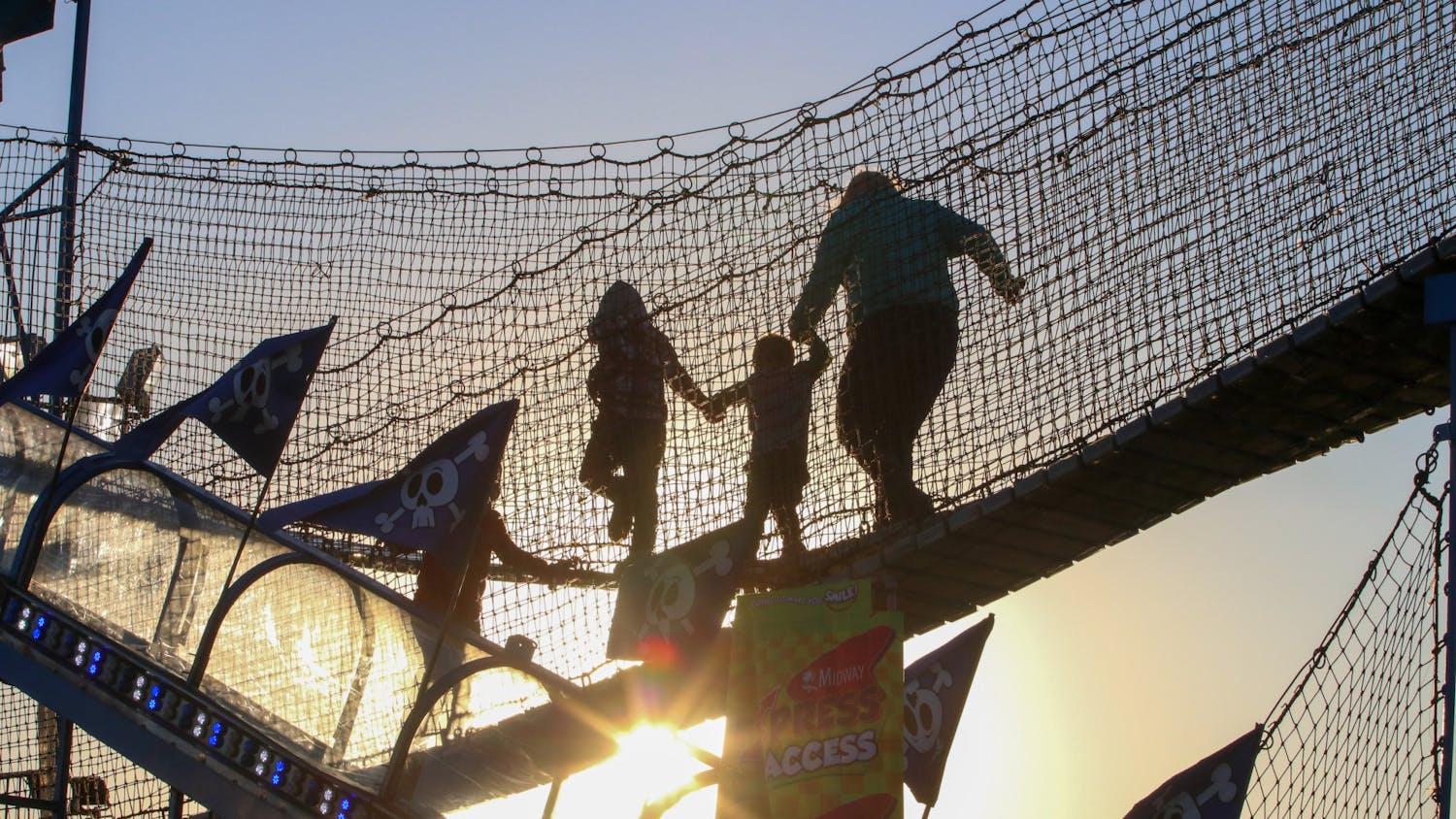 As the sun went down, families made their way across a bridge that was just one part of a bigger jungle gym. While some kids were found speeding across the bridge, this family took their time, hand in hand, to complete the course on Oct. 18, 2022.&nbsp;