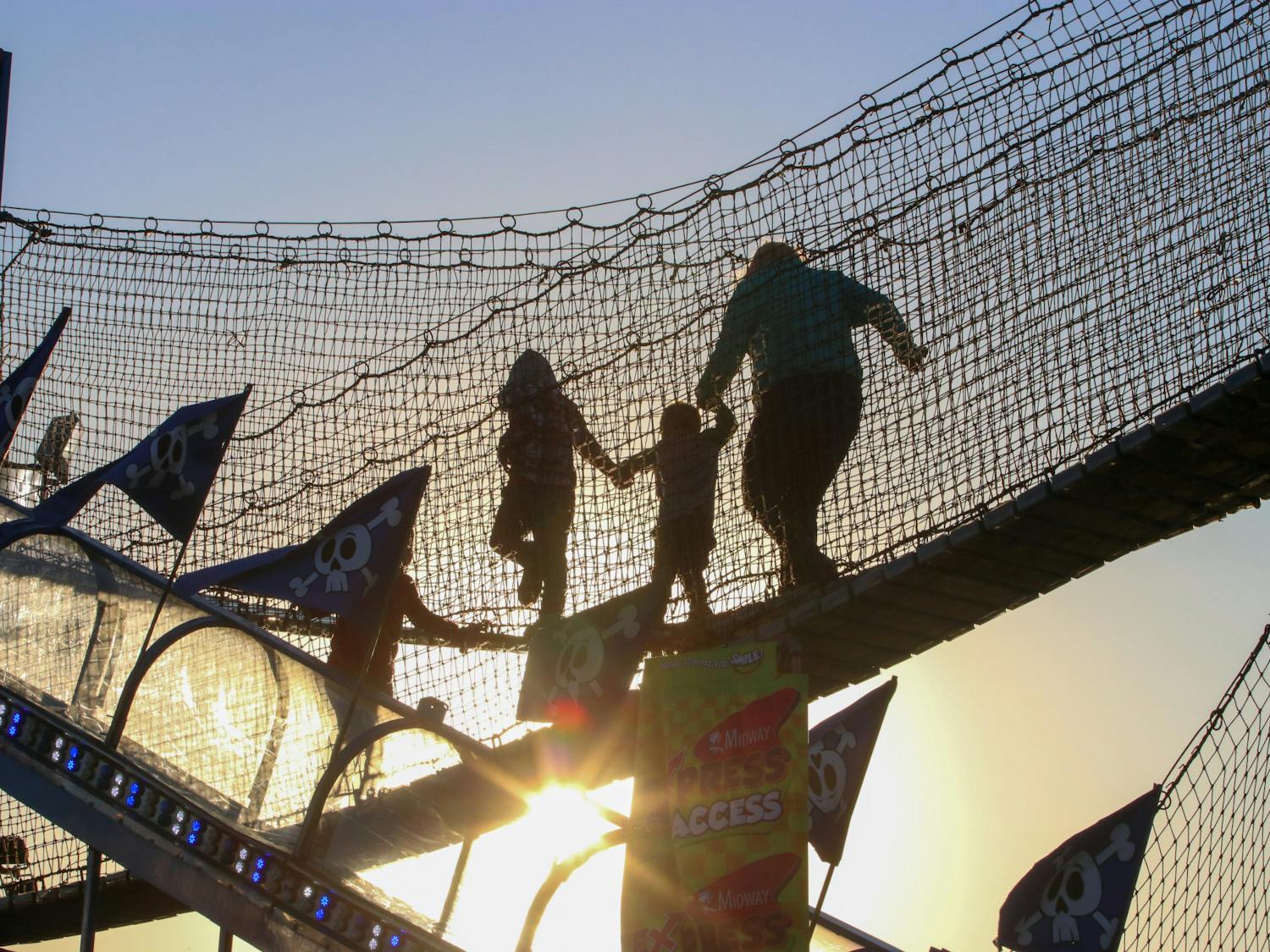 As the sun went down, families made their way across a bridge that was just one part of a bigger jungle gym. While some kids were found speeding across the bridge, this family took their time, hand in hand, to complete the course on Oct. 18, 2022.&nbsp;