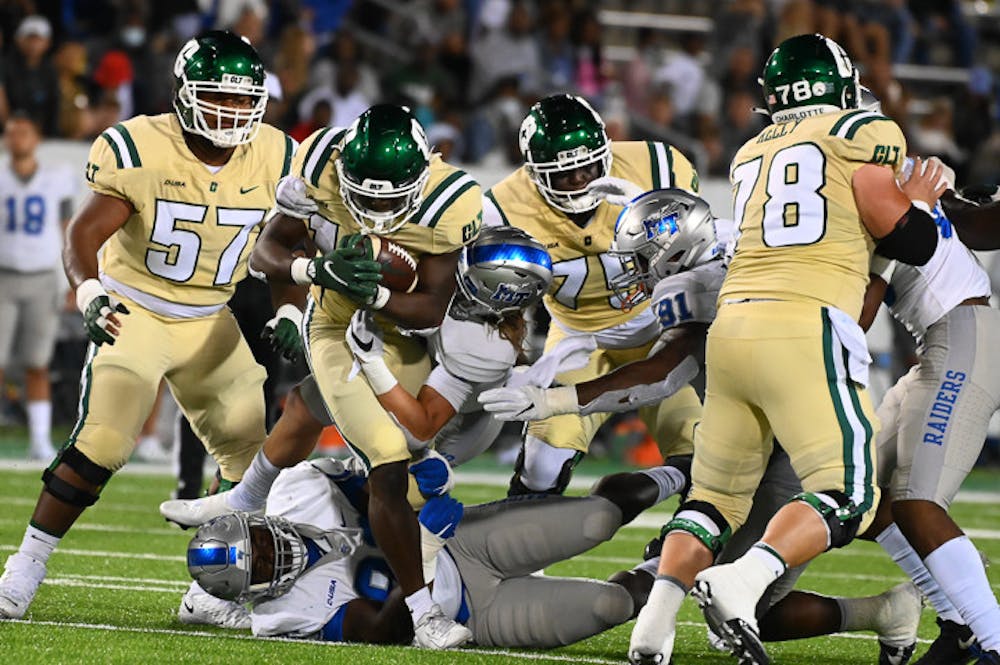 The 49ers run the ball down the field as the Middle Tennessee Blue Raiders come in for the tackle during their matchup on September 24, 2021. The 49ers beat the Blue Raiders 42-39.