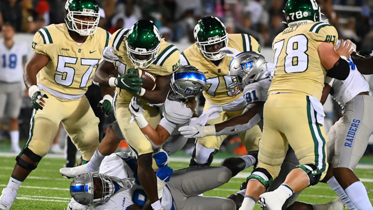 The 49ers run the ball down the field as the Middle Tennessee Blue Raiders come in for the tackle during their matchup on September 24, 2021. The 49ers beat the Blue Raiders 42-39.