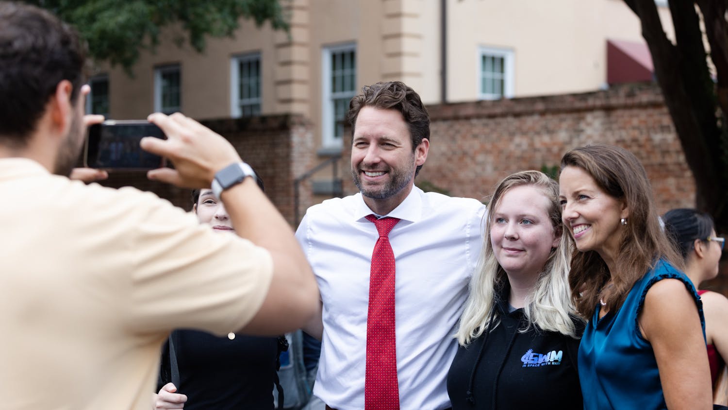 Joe Cunningham and his running mate Tally Casey pose for a picture with students on Greene Street on Aug. 25, 2022. The candidates for governor and lieutenant governor met with students during the organization fair.