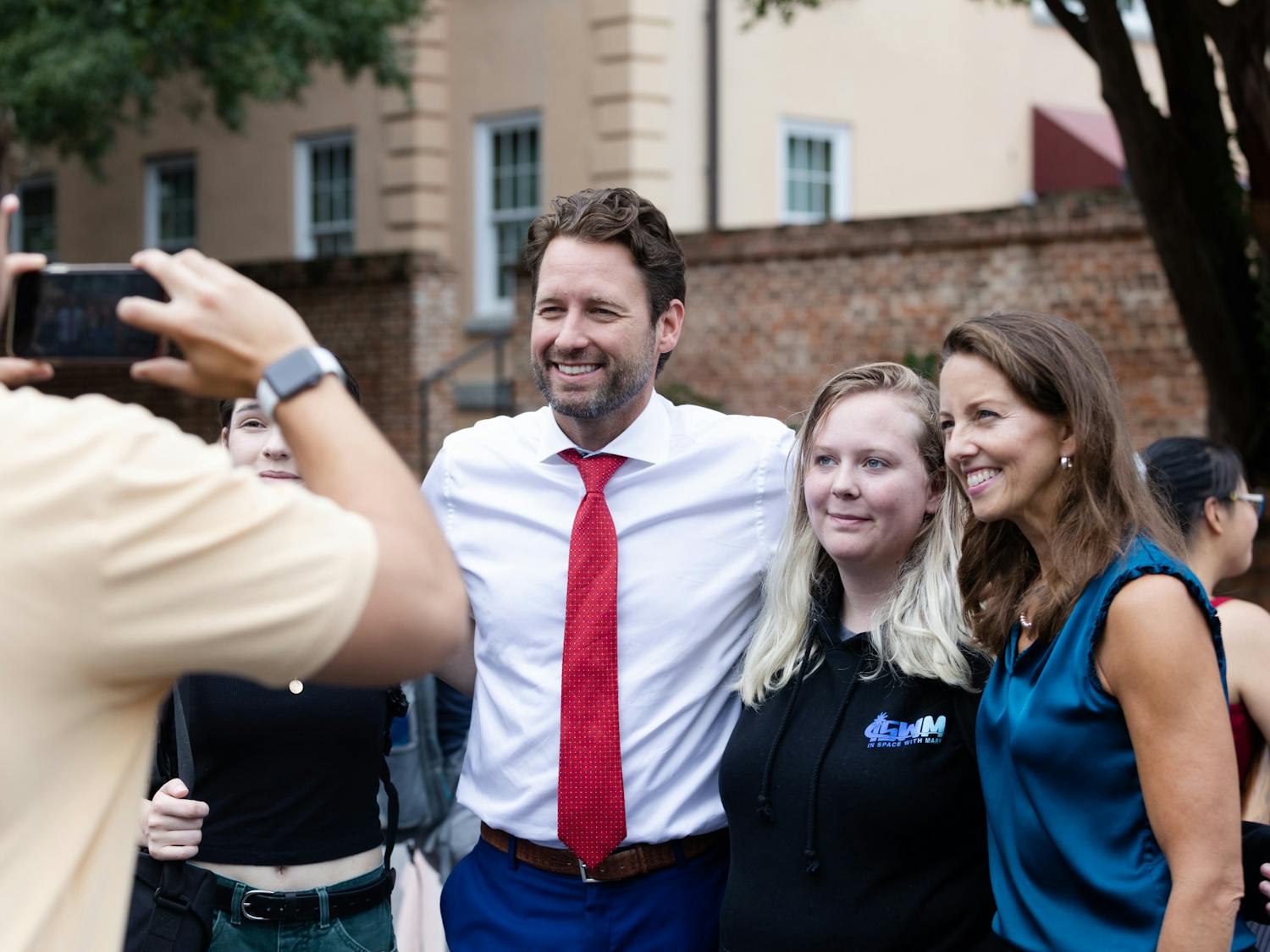 Joe Cunningham and his running mate Tally Casey pose for a picture with students on Greene Street on Aug. 25, 2022. The candidates for governor and lieutenant governor met with students during the organization fair.