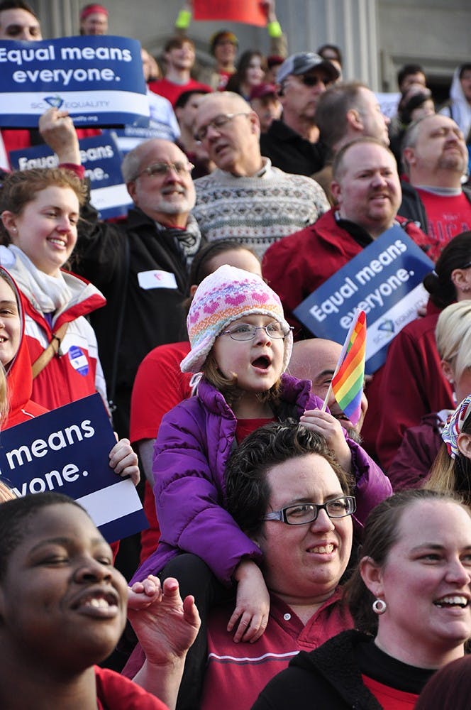 People of all ages gathered in front of the Statehouse on Tuesday to oppose the two bills being challenged in the Supreme Court — Proposition 8 and the Defense of Marriage Act.