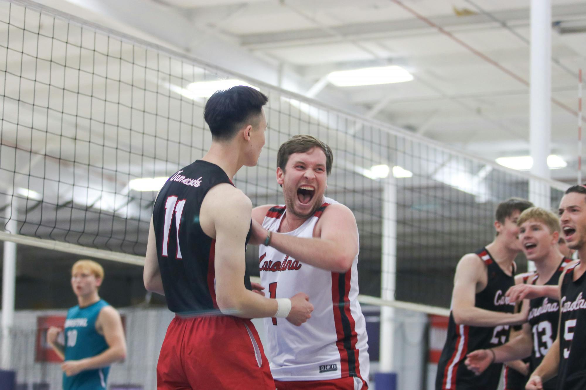 Senior libero Patrick Ertel celebrates a major kill from senior outside Steven Cao alongside players of the Garnet team. Ertel had a particularly notable game against Coastal Carolina A, making key saves for the Garnet team to keep them alive in the match.&nbsp;