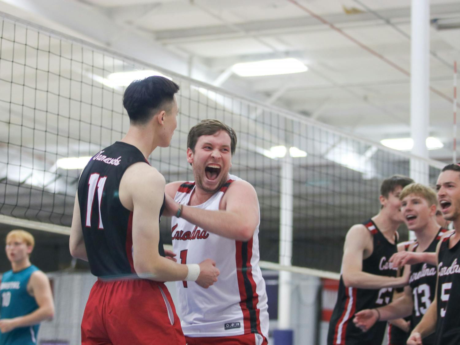 Senior libero Patrick Ertel celebrates a major kill from senior outside Steven Cao alongside players of the Garnet team. Ertel had a particularly notable game against Coastal Carolina A, making key saves for the Garnet team to keep them alive in the match. 
