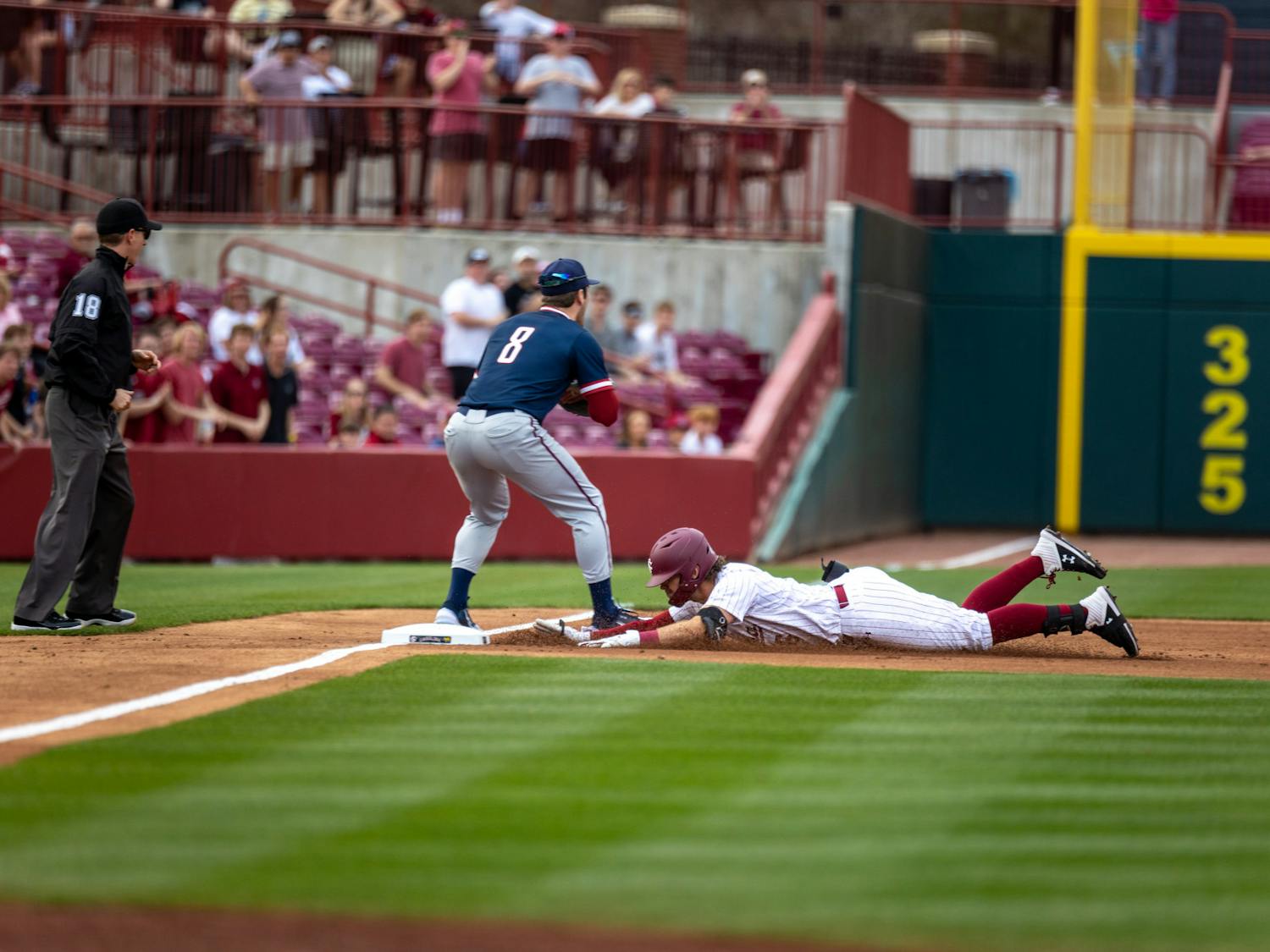 Fifth-year infield Will McGillis slides onto third base and is safe during the South Carolina matchup against UPenn at Founders Park on Feb. 24, 2023. The Gamecocks won the first game in the series 7-4.