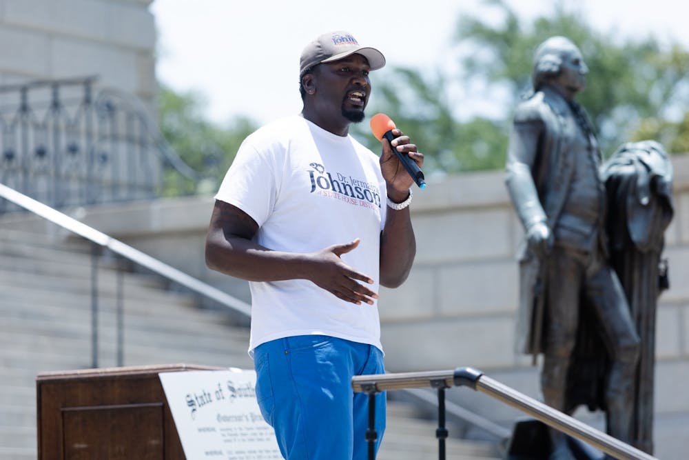 <p>Rep. Jermaine Johnson (D-Richland) speaks to the crowd during the "Wear Orange" rally on June 4, 2022. Speakers at the rally called for lawmakers to combat gun violence.&nbsp;</p>