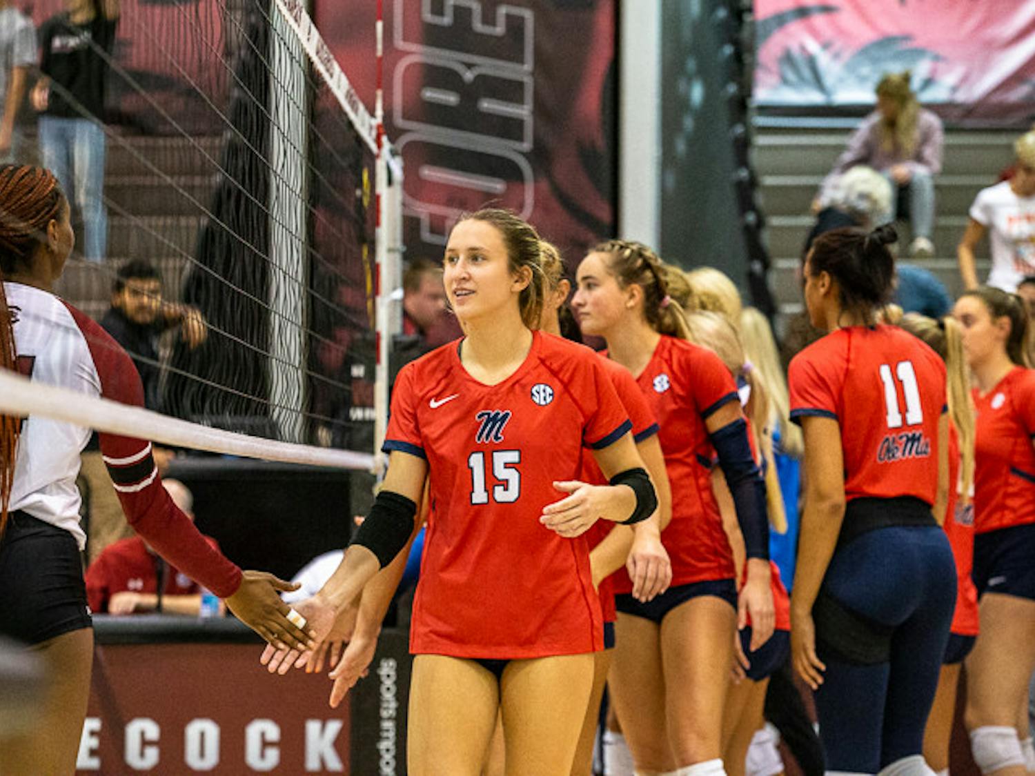Ole Miss freshman setter Aly Borellis high-fives a member of the South Carolina volleyball team after their matchup on Nov. 5, 2022. Ole Miss won the match 3-1, scoring 25-21 in the final set of the game.