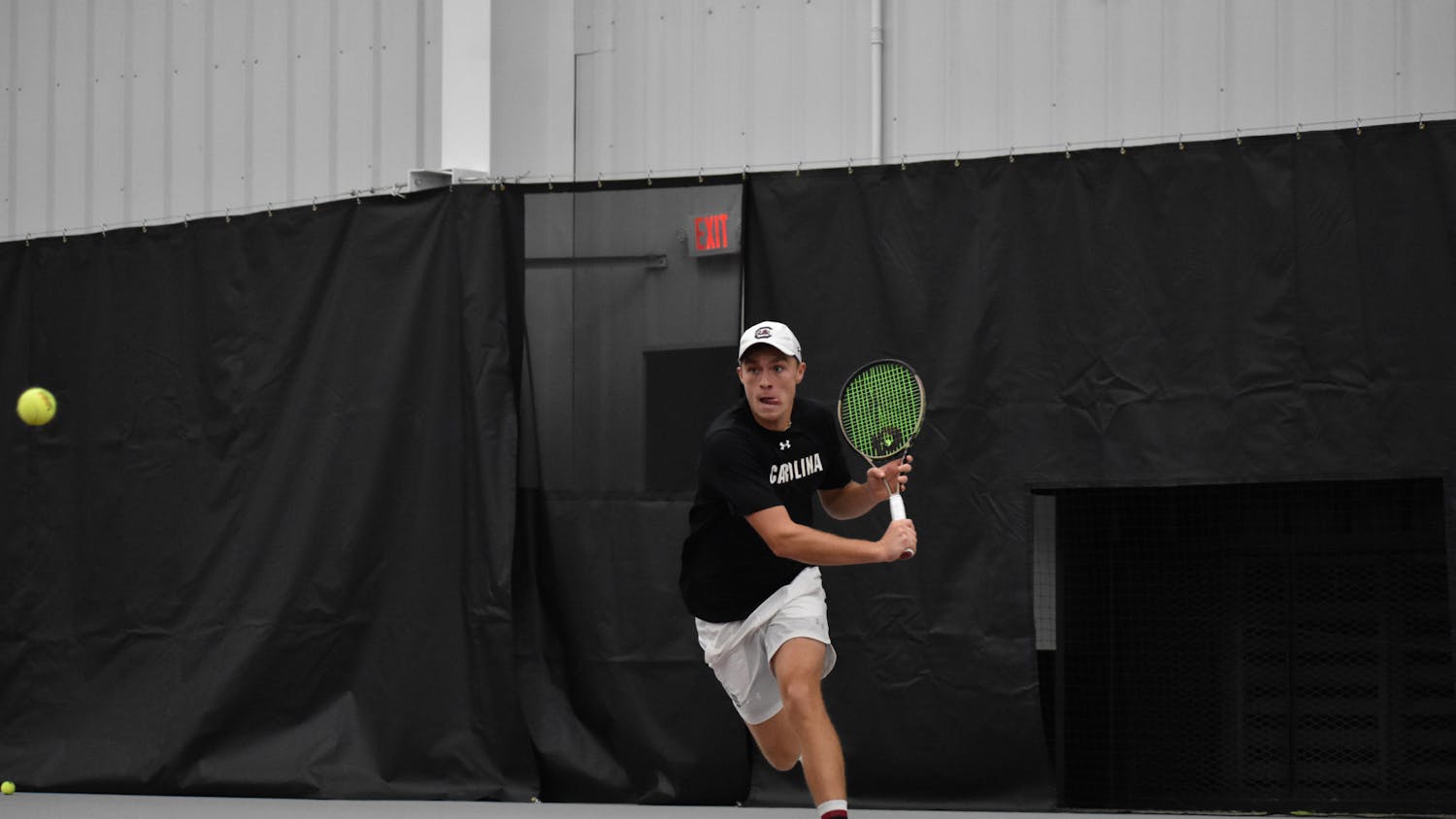 Junior James Story races to return a short-hit ball during his singles match on day two of the ITA Kickoff Weekend event at the Carolina Indoor Tennis Center on Jan. 29, 2023. The South Carolina Gamecocks beat N.C. State 4-0, making it the winner of the ITA tournament.&nbsp;