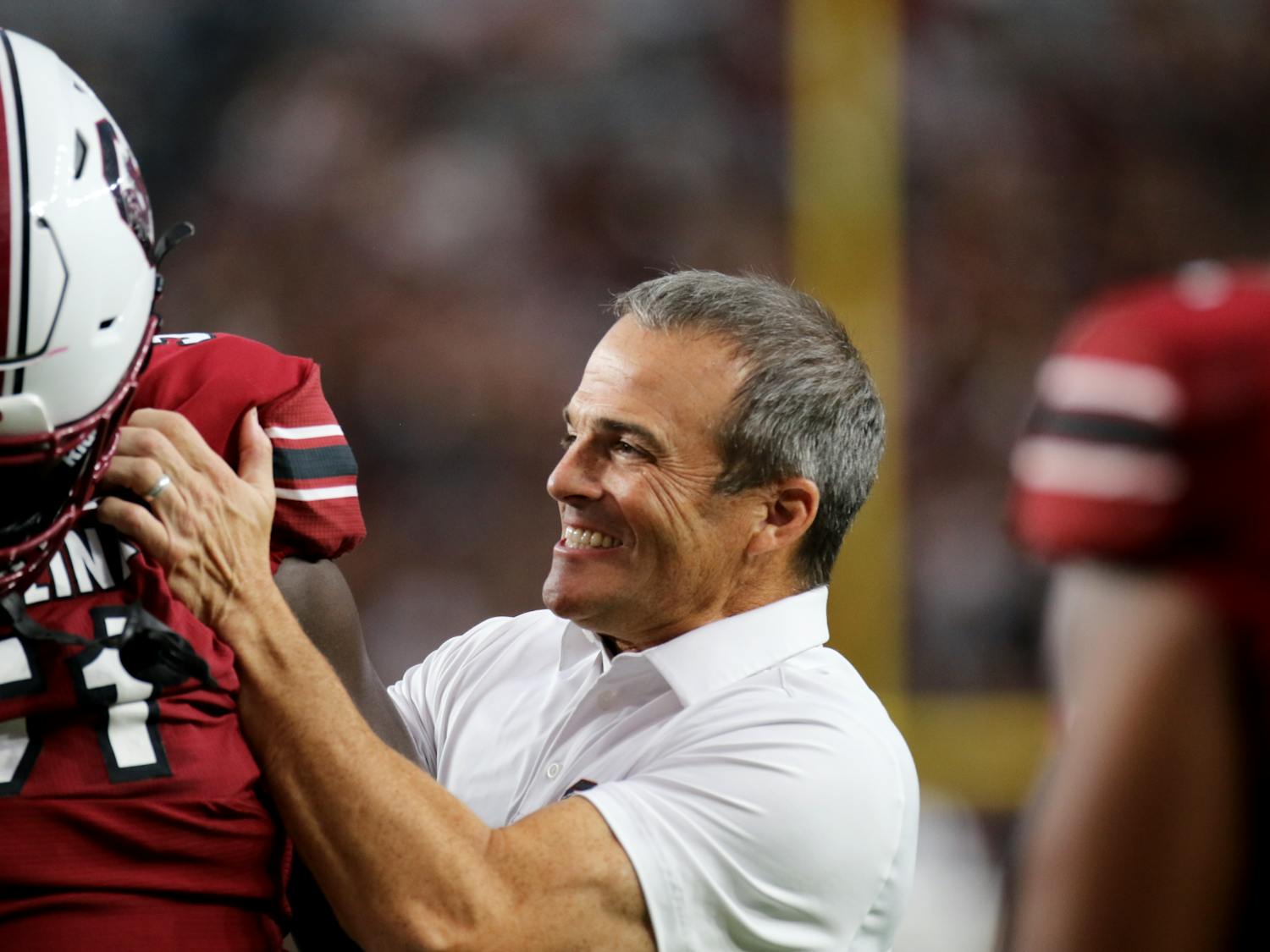 South Carolina head coach Shane Beamer interacts with freshman offensive lineman Tree Babalade after warming up for the game against Mississippi State on Sept. 23, 2023. The true freshman has appeared in multiple games and won True Freshman of the Week after he played in the game against Georgia.