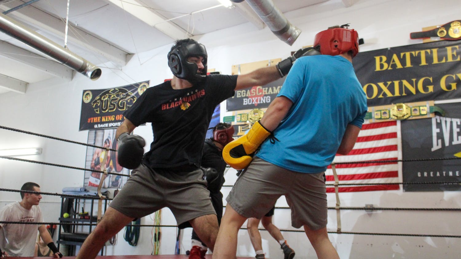 Members of the Carolina Boxing Club trade shots for an advantage in the ring during a sparring practice on Feb. 18, 2022. Boxing club practices include a variety of workouts focusing around cardio, combo training and strength training.