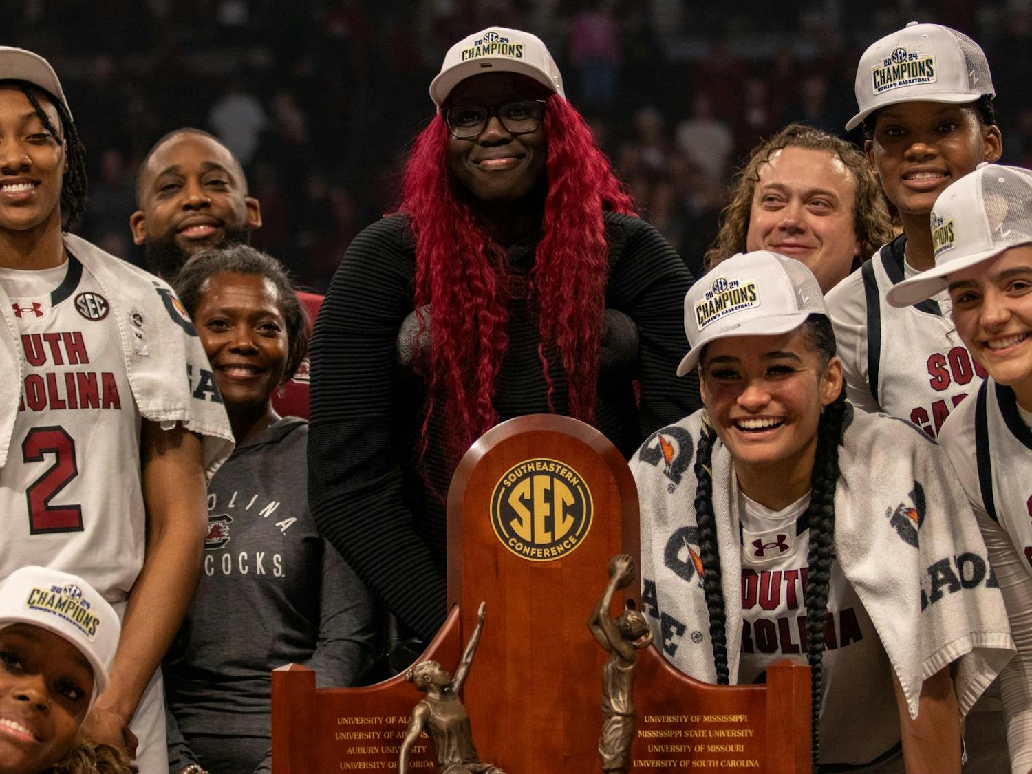 South Carolina women’s basketball players accept and surround the 2023-2024 SEC Conference Championship trophy at Colonial Life Arena on Feb. 22, 2024. South Carolina defeated Alabama 72-44 — a victory that marked head coach Dawn Staley’s 600th career win as head coach.