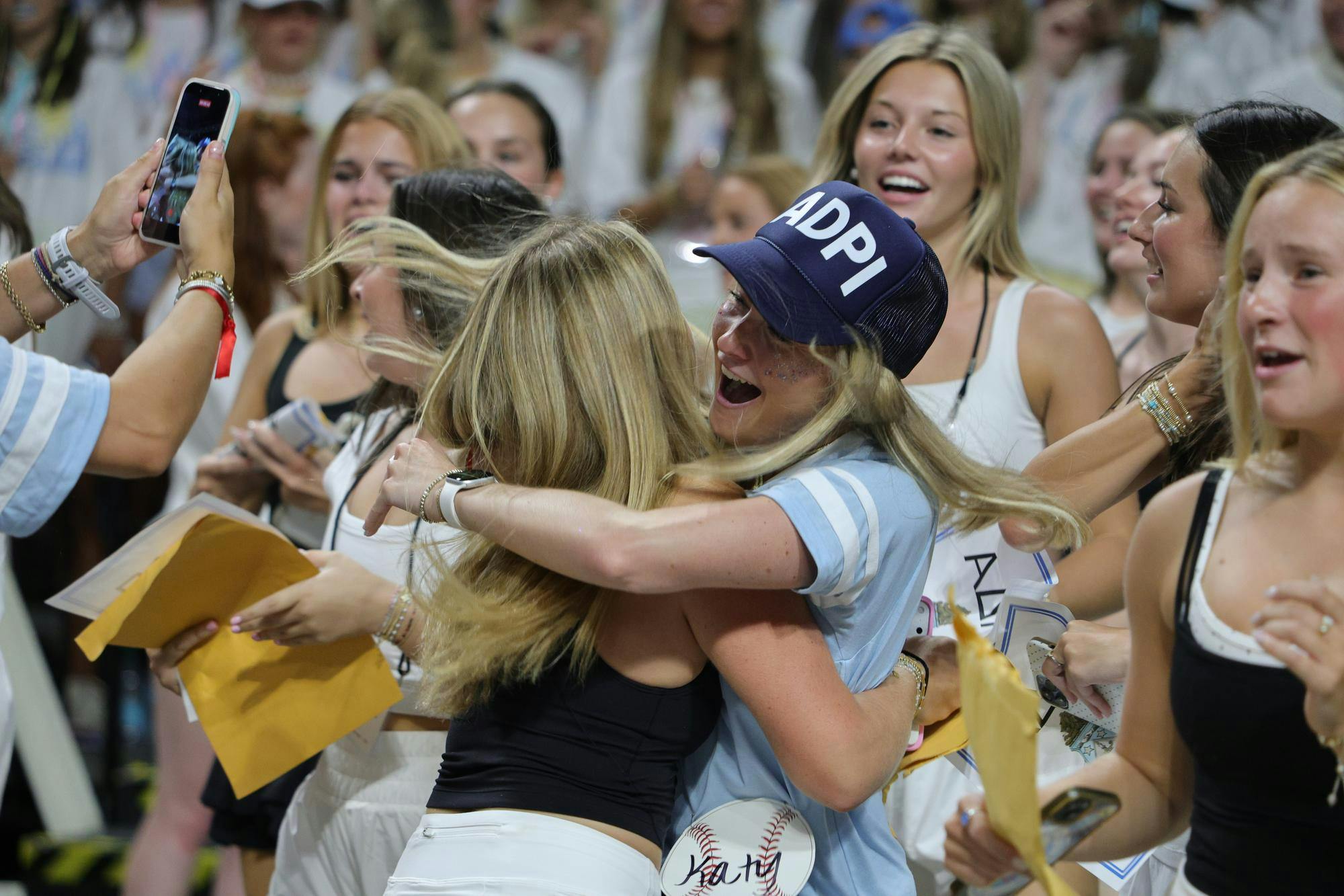 A new member of Alpha Delta Pi embraces a sorority member during Bid Day on Aug. 16, 2026, at Colonial Life Arena. Members greet the new arrivals as they gather with the sorority inside the arena