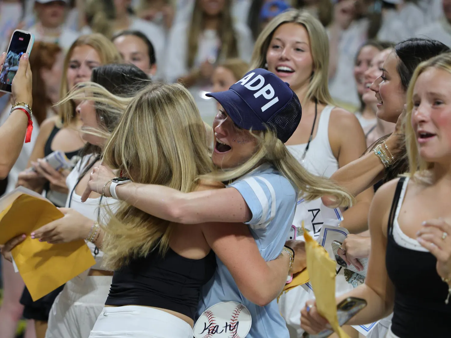 A new member of Alpha Delta Pi embraces a sorority member during Bid Day on Aug. 16, 2026, at Colonial Life Arena. Members greet the new arrivals as they gather with the sorority inside the arena