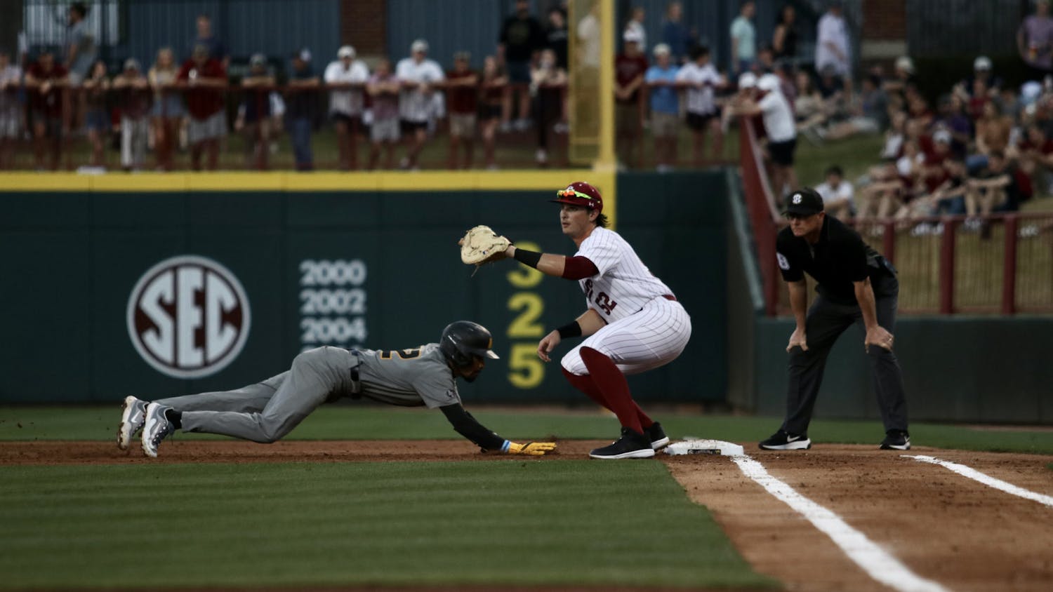 Junior first baseman Gavin Casas catches the ball at first base, striking out the Mizzou opponent after he attempted to steal second base. The Gamecocks take home a 9-8 win in Founders Park on March 23, 2023.&nbsp;