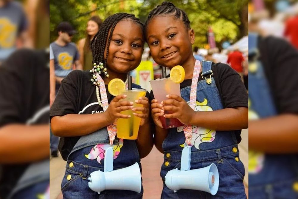 <p>Faith and Malia Jeffcoat, better known as the Lemonade Twins, pose for a portrait photograph with their classic beverages at Soda City market in Columbia, South Carolina. Flavors such as cotton candy came from collaborations with each other as well as business partners.&nbsp;</p>