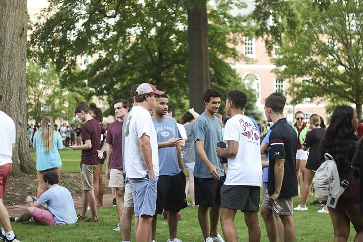 Students gather on the horseshoe for "First Night Carolina" on Wednesday evening.&nbsp;