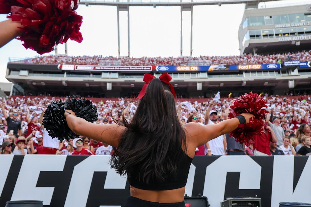 <p>FILE — A South Carolina cheerleader dances in front of the home team side at Williams-Brice Stadium during a football game on Aug. 31, 2024.</p>