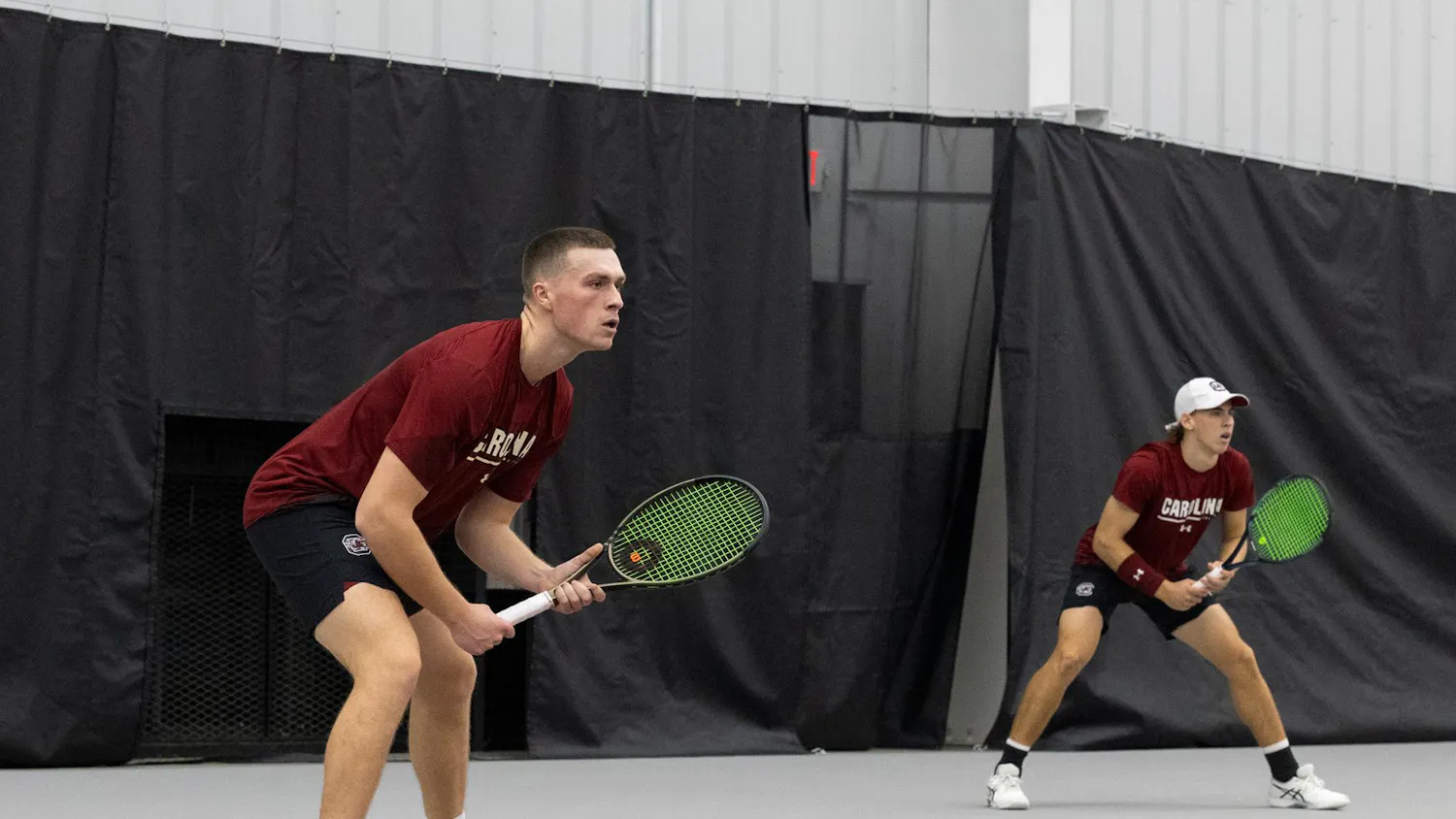 Senior James Story and junior Casey Hoole get into position during South Carolina’s match against NC State at the Carolina Indoor Tennis Center on Feb. 2, 2024. Hoole and Story won their first doubles match together this season 6-4.