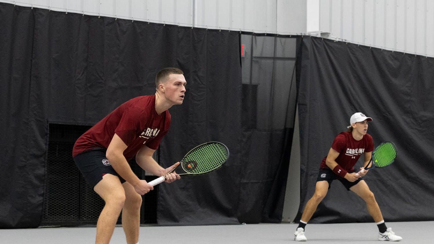 Senior James Story and junior Casey Hoole get into position during South Carolina’s match against NC State at the Carolina Indoor Tennis Center on Feb. 2, 2024. Hoole and Story won their first doubles match together this season 6-4.