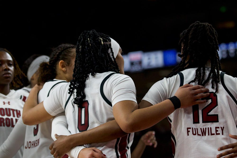 <p>Freshman guard Tessa Johnson, senior guard Te-Hina Paopao and freshman guard MiLaysia Fulwiley huddle together during a timeout against the Kentucky Wildcats. The trio contributed 39 points during South Carolina’s 98-36 victory over Kentucky on Jan. 15, 2023.</p>