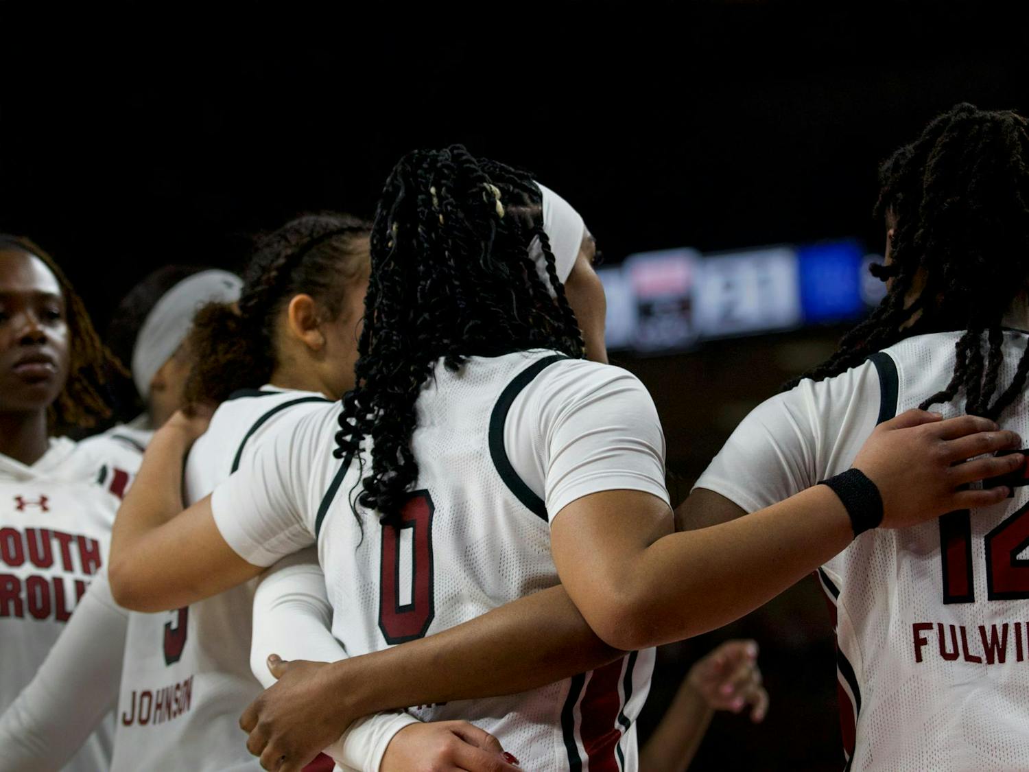 Freshman guard Tessa Johnson, senior guard Te-Hina Paopao and freshman guard MiLaysia Fulwiley huddle together during a timeout against the Kentucky Wildcats. The trio contributed 39 points during South Carolina’s 98-36 victory over Kentucky on Jan. 15, 2023.