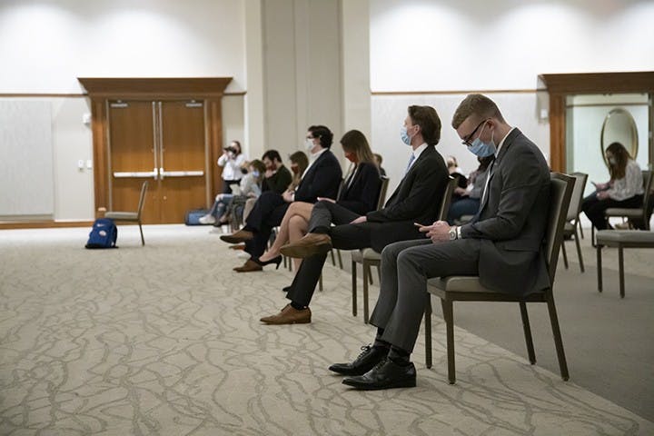 Treasurer candidates sit in the front row after answering a series of general questions and individual captions.
