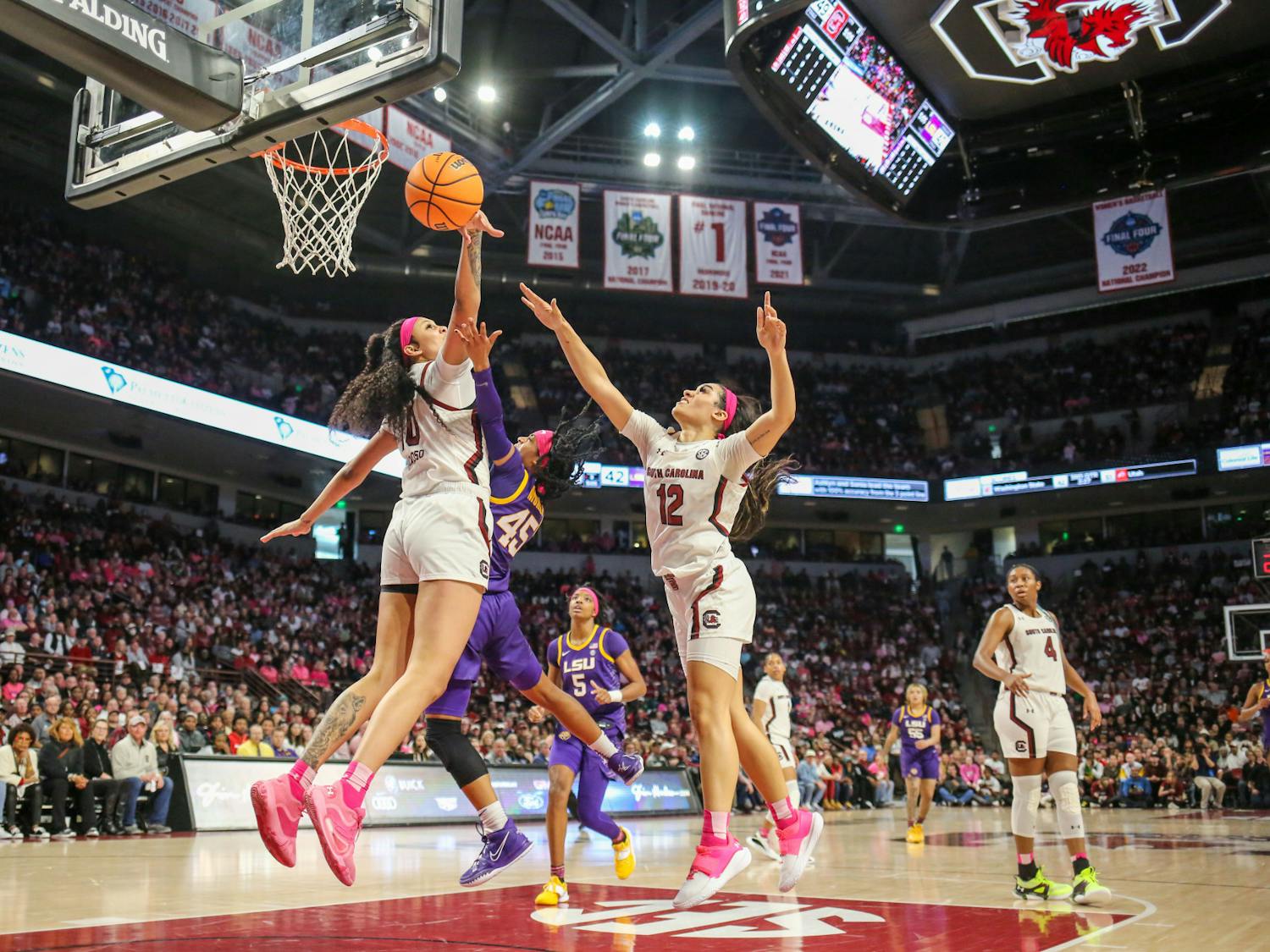 Gamecocks' junior center Kamilla Cardoso and senior guard Brea Beal attempt to block a shot put up by LSU’s Alexis Morris during the teams' matchup at Colonial Life Arena on Feb. 12, 2023. The Gamecocks beat the Tigers 88-64.