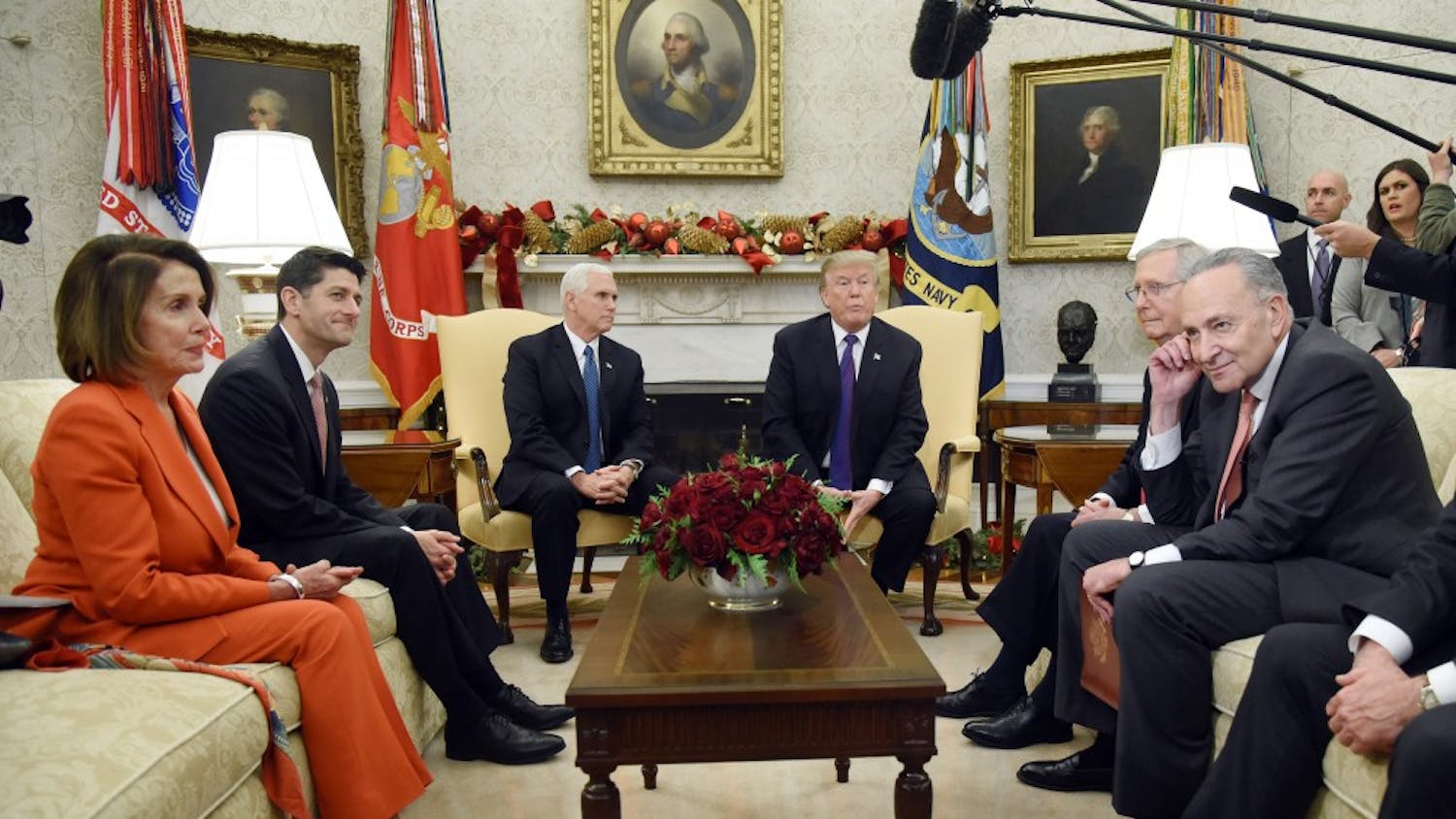 U.S. President Donald Trump and Vice President Mike Pence look on during a meeting with Congressional leadership including House Minority Leader Rep. Nancy Pelosi (D-Calif.), House Speaker Paul Ryan (R-Wis.), Senate Majority Leader Mitch McConnell, and Sen. Charles Schumer (D-NY) in the Oval Office of the White House Thursday, Dec. 7, 2017 in Washington, D.C.  (Olivier Douliery/Abaca Press/TNS) 