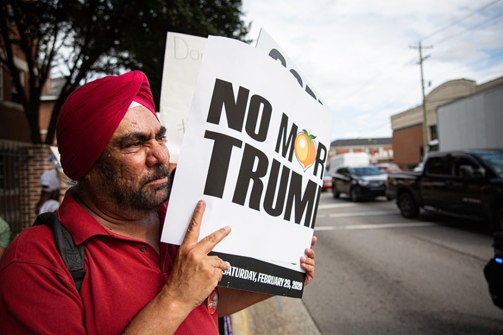 A protester walking to Benedict College from Sen. Cory Booker's office at Columbia Oct. 25.