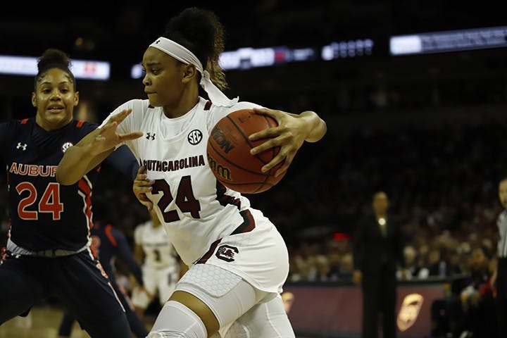 Senior guard Lele Grissett dribbles the ball past an Auburn player. During her time at USC, Grissett had a total of 635 points, 63 blocks and 93 assists.