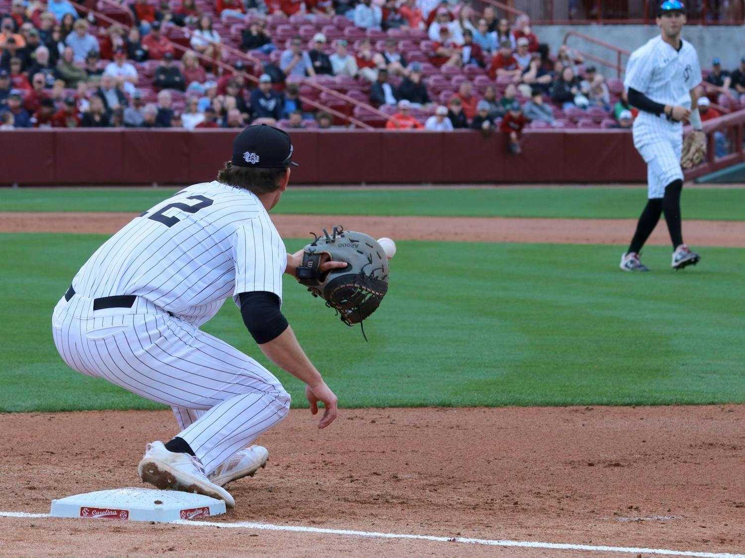 Senior infielder Tyler Causey catches an out on first base as South Carolina defeats Vanderbilt at Founders Park on March 23, 2024. Causey had eight put-outs during the Gamecocks' 8-3 victory.